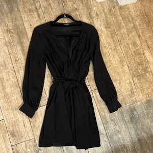 Black Topshop long sleeve wrap style dress. Size 6 but fits like a 4
